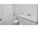 Clean bathroom with white subway tile, bathtub, and quartz vanity at 5830 Sw 121 St, Ocala, FL 34481