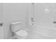 Bathroom with white subway tile and a shower/tub combo at 5830 Sw 121 St, Ocala, FL 34481