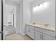 Double vanity bathroom with neutral cabinets and a view to bedroom at 5830 Sw 121 St, Ocala, FL 34481