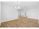 Open concept dining room with wood floors and kitchen view at 5830 Sw 121 St, Ocala, FL 34481