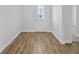 Foyer with wood-look flooring and white walls at 5830 Sw 121 St, Ocala, FL 34481
