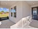 Covered front porch with windows and a door at 5830 Sw 121 St, Ocala, FL 34481