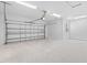 Spacious garage with overhead door and light-colored walls at 5830 Sw 121 St, Ocala, FL 34481