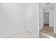 Clean hallway with access to pantry and other rooms at 5830 Sw 121 St, Ocala, FL 34481