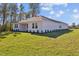 Single story house with light colored exterior and landscaped backyard at 5830 Sw 121 St, Ocala, FL 34481