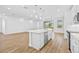Bright kitchen with island, stainless steel appliances, and white cabinets at 5830 Sw 121 St, Ocala, FL 34481
