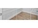 Walk-in pantry with wire shelving and light wood flooring at 5830 Sw 121 St, Ocala, FL 34481