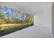 Covered patio with view of backyard and surrounding trees at 5830 Sw 121 St, Ocala, FL 34481