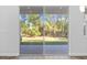 Sliding glass door leads to backyard with a view of trees at 5830 Sw 121 St, Ocala, FL 34481