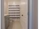 Clean bathroom with gray vanity and striped shower curtain at 3681 Magnolia Dr, Indian Lake Estates, FL 33855
