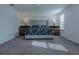 Main bedroom with king-size bed, nightstands, and plush carpeting at 3681 Magnolia Dr, Indian Lake Estates, FL 33855