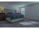 Bright bedroom with king-size bed, nightstands and window coverings at 3681 Magnolia Dr, Indian Lake Estates, FL 33855