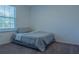 Small bedroom with a single bed and window at 3681 Magnolia Dr, Indian Lake Estates, FL 33855
