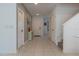 Open entryway with staircase, tile floors, and access to other rooms at 3681 Magnolia Dr, Indian Lake Estates, FL 33855