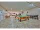 Game room featuring billiard tables and comfortable seating at 3681 Magnolia Dr, Indian Lake Estates, FL 33855