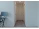 Clean hallway with carpet, doors to bedrooms, and ample light at 3681 Magnolia Dr, Indian Lake Estates, FL 33855