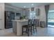 Modern kitchen featuring gray cabinets, stainless steel appliances, and an island at 3681 Magnolia Dr, Indian Lake Estates, FL 33855