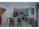 Modern kitchen with gray cabinets, stainless steel appliances, and an island at 3681 Magnolia Dr, Indian Lake Estates, FL 33855