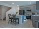 Modern kitchen with gray cabinets, stainless steel appliances and island at 3681 Magnolia Dr, Indian Lake Estates, FL 33855