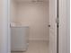 Laundry room with washer and dryer, and access to a small bathroom at 3681 Magnolia Dr, Indian Lake Estates, FL 33855