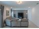 Spacious living area with sectional sofa and large TV at 3681 Magnolia Dr, Indian Lake Estates, FL 33855