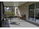 Relaxing screened porch with seating and backyard view at 3681 Magnolia Dr, Indian Lake Estates, FL 33855