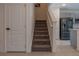 Carpeted stairs leading to the upper level at 3681 Magnolia Dr, Indian Lake Estates, FL 33855