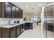 Modern kitchen with stainless steel appliances and granite countertops at 16317 Saint Augustine St, Clermont, FL 34714