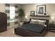 Spacious bedroom with a dark wood platform bed at 2607 Candied Apple Aly, Kissimmee, FL 34744