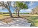 Relaxing picnic table by a pond with lush trees at 2628 Peace Of Mind Ave, Kissimmee, FL 34744