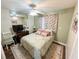 Bedroom with wood floors, ceiling fan, and views of the exterior at 1600 W Lake Parker Dr # A6, Lakeland, FL 33805