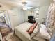 Bedroom with wood floors, ceiling fan, and large closets with views of the hallway at 1600 W Lake Parker Dr # A6, Lakeland, FL 33805