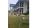 Low-rise apartment building featuring screened balconies, mature landscaping, and architectural facade at 1600 W Lake Parker Dr # A6, Lakeland, FL 33805