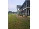 View of a low-rise condo building with screened in patios overlooking well-maintained landscaping and greenspace at 1600 W Lake Parker Dr # A6, Lakeland, FL 33805