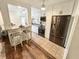 Modern kitchen featuring stainless steel appliances, white cabinets, granite countertops, and an eat-in bar at 1600 W Lake Parker Dr # A6, Lakeland, FL 33805