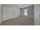 Simple bedroom with neutral walls and carpet flooring at 645 Yak Ct, Poinciana, FL 34759