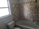 Bathroom with shower/tub combo and tile at 810 Avenue L Sw, Winter Haven, FL 33880