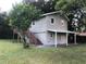 Two-story house with covered porch and yard at 810 Avenue L Sw, Winter Haven, FL 33880