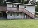 House exterior with deck and stairs at 810 Avenue L Sw, Winter Haven, FL 33880