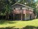 House exterior with deck and yard at 810 Avenue L Sw, Winter Haven, FL 33880