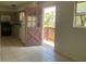 Simple kitchen with appliances and door to outside at 810 Avenue L Sw, Winter Haven, FL 33880