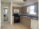 Basic kitchen with microwave, stove, and dishwasher at 810 Avenue L Sw, Winter Haven, FL 33880