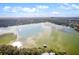 Aerial view of lakefront property with dock and beautiful water views at 1614 King James Ct, Lakeland, FL 33813