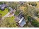 Property's aerial view showcasing pool and landscaping at 1614 King James Ct, Lakeland, FL 33813