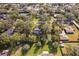 Aerial view of property with large backyard and pool at 1614 King James Ct, Lakeland, FL 33813