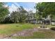 Spacious backyard with fire pit and picnic table at 1614 King James Ct, Lakeland, FL 33813