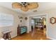 Spacious bedroom with hardwood floors and access to another room at 1614 King James Ct, Lakeland, FL 33813