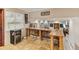 Breakfast bar with wood countertop and stools, offering a view of the living room at 1614 King James Ct, Lakeland, FL 33813