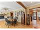 Charming dining room with hardwood floors, round table, and black chairs at 1614 King James Ct, Lakeland, FL 33813