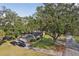 House with a large yard and mature trees at 1614 King James Ct, Lakeland, FL 33813